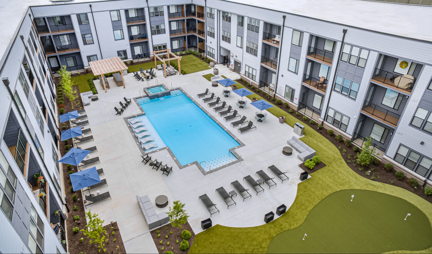 Aerial view of pool and putting green