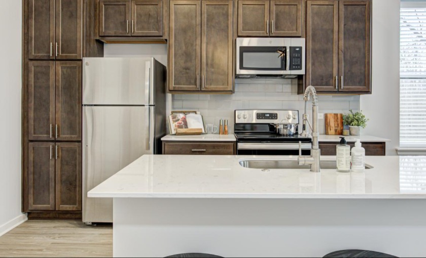 a kitchen with a white counter top